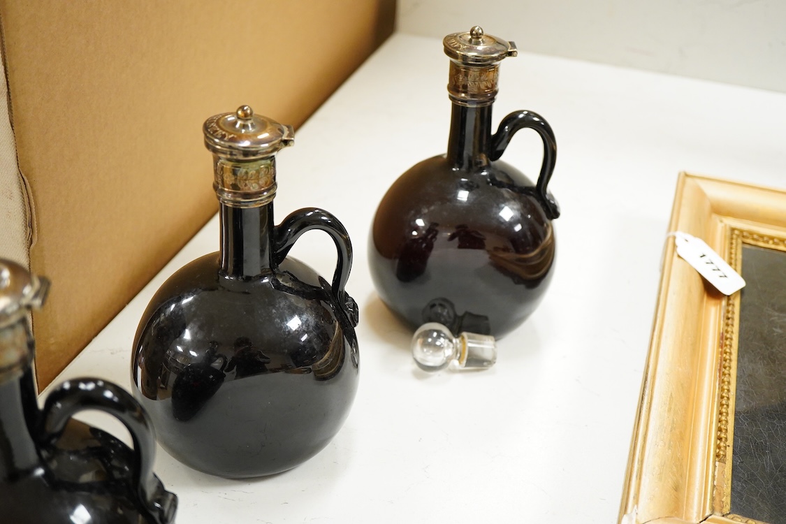 Three Victorian silver mounted glass spirit flasks, engraved 'Brandy', 'Whisky' and 'Gin', Atkin Brothers, Sheffield, 1874, 20.7cm.